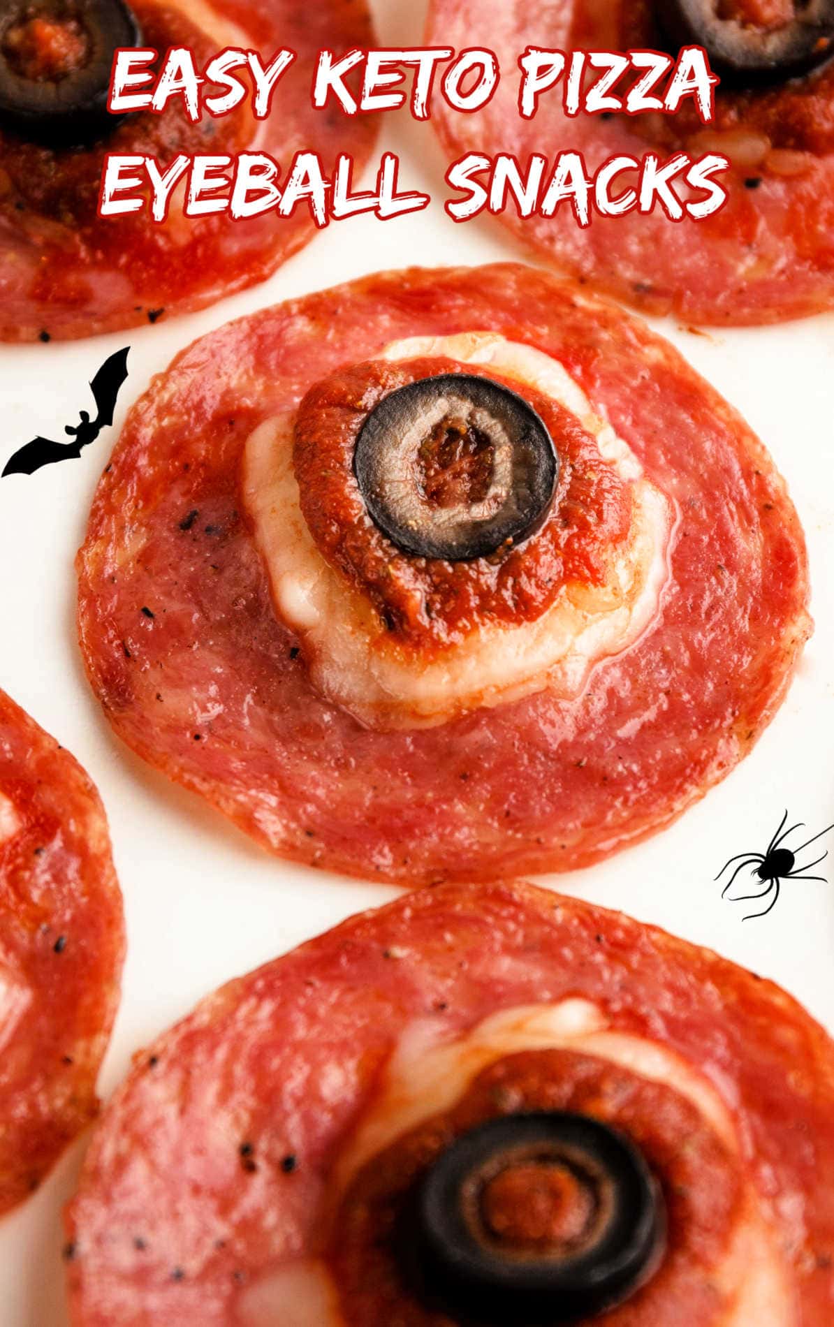 keto and paleo pizza eyeball snacks made with pepperoni and pizza toppings.