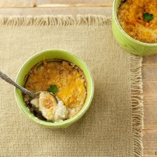 Baked Garlic Cauliflower Mash with Cheese Crust - Low carb, gluten free, primal, healthy alternative to mash potatoes. Oh so yummy!