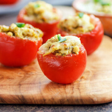 Shredded chicken and pesto sauce stuffed in a tomato with melted cheese.