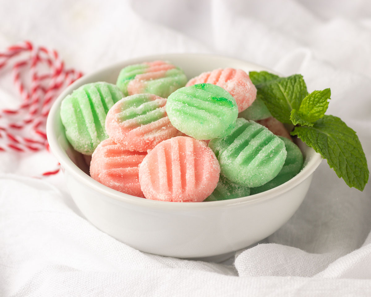 A bowl of pink & green mints.
