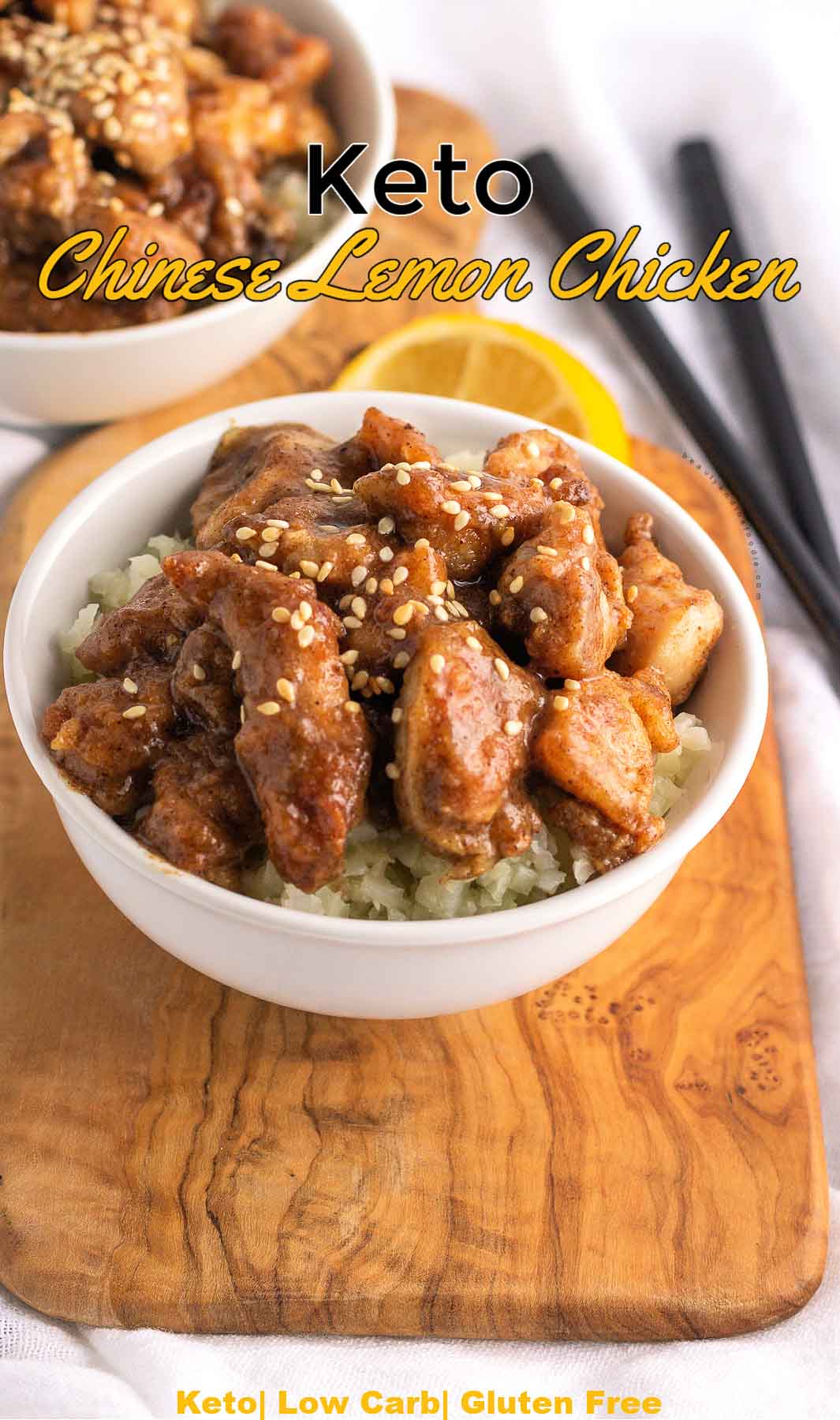 Bowls of Chinese lemon chicken with cauliflower rice and chopsticks.