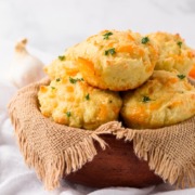 A basket of cheesy garlic biscuits.