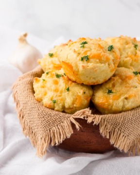 A basket of low carb cheddar garlic biscuits.