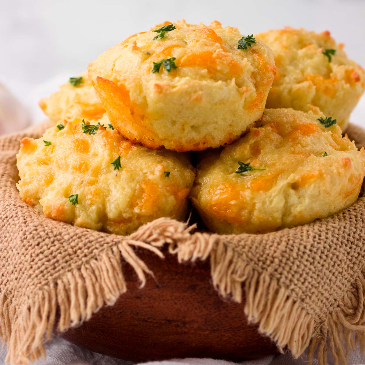 A basket of cheesy garlic biscuits that are low carb.