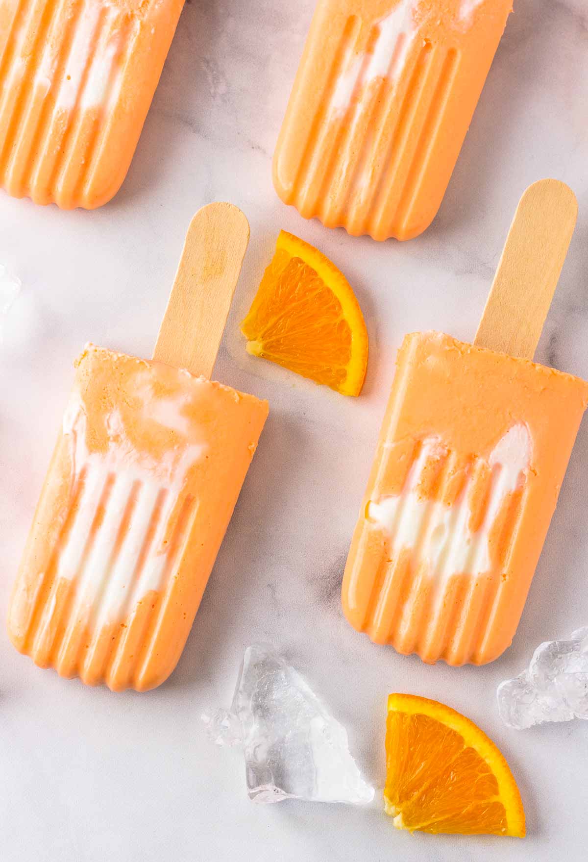 Keto Orange Creamsicle Pops are Creamy orange and vanilla keto popsicles.