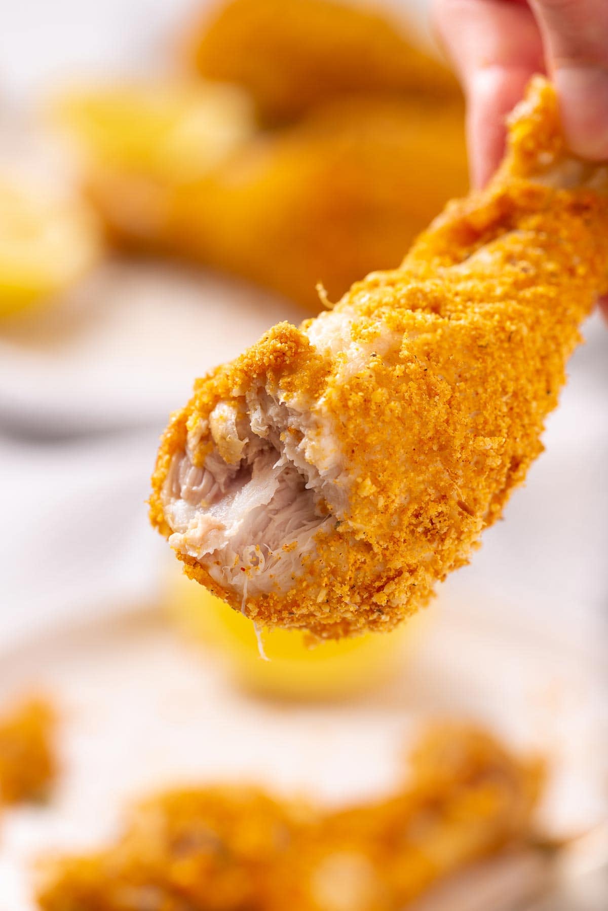 A chicken drumstick with a bite in it.