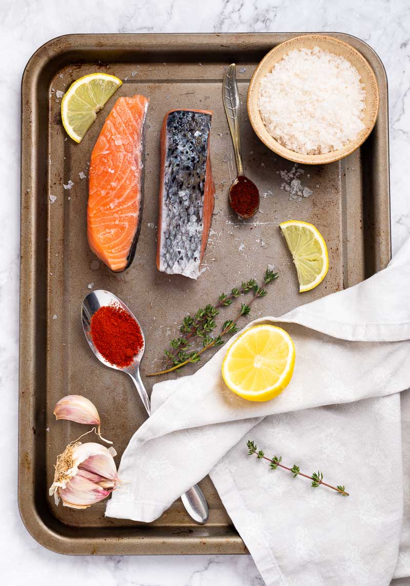 Ingredients  and spices for making air fryer salmon.