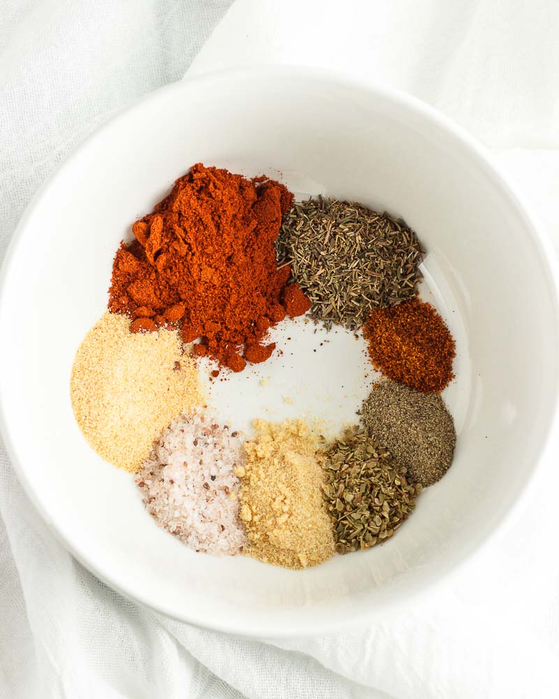 A bowl of spices for making Cajun seasoning mix.
