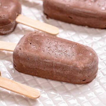 Low carb chocolate fudgesicles on a white plate.