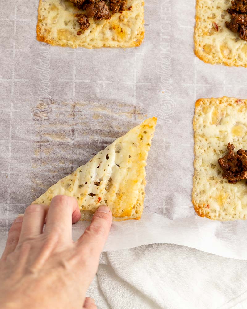 Folding the cheese over taco meat.