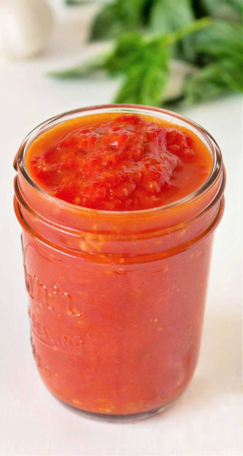 Marinara sauce in a glass jar.