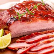 A low carb sweet glazed ham that has been sliced.