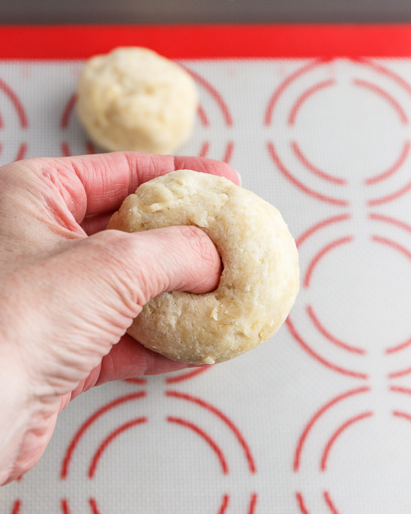  Creating the hole in the bagel dough.