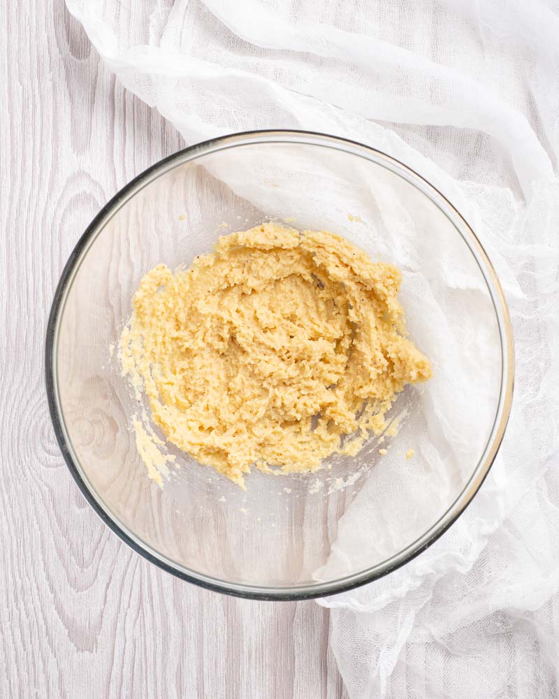 In a large bowl or food processor, mix one egg with the almond flour.