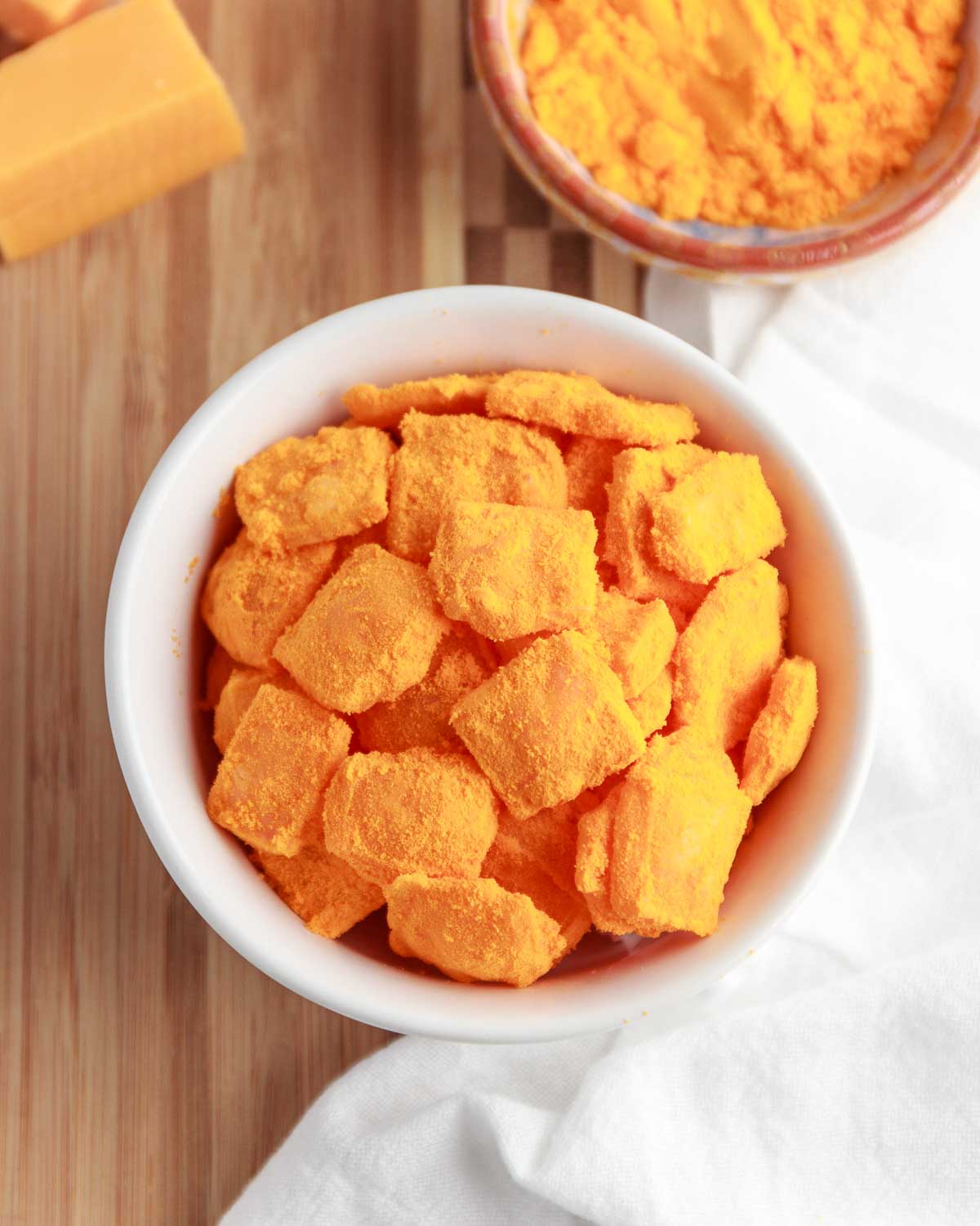 A bowl of homemade keto crunchy cheese puffs.