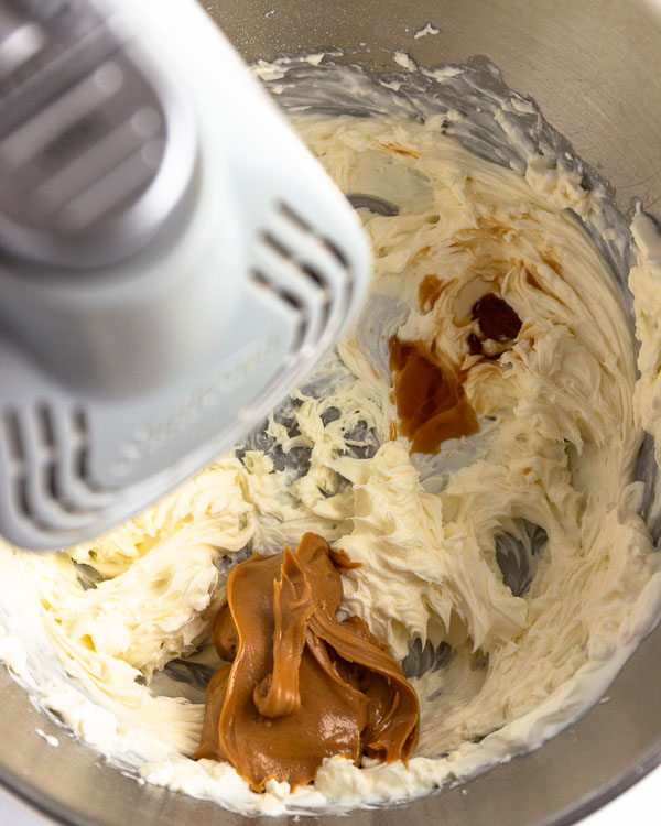 Adding peanut butter and vanilla extract.
