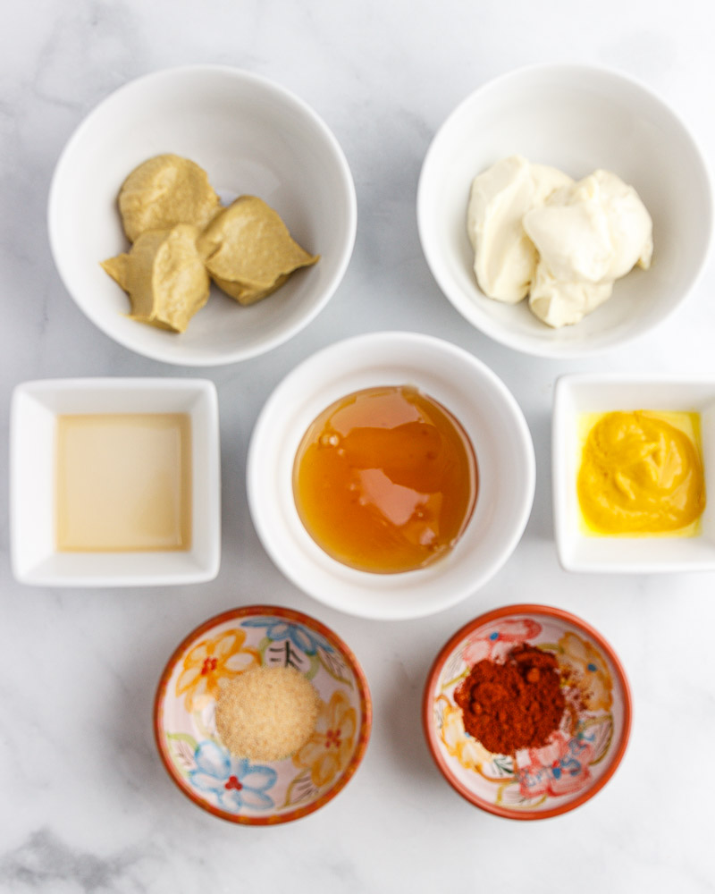 The ingredients for making keto honey mustard dressing.