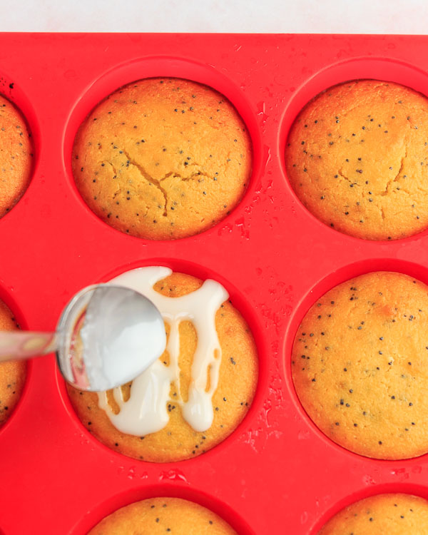 Drizzle icing on the muffins.