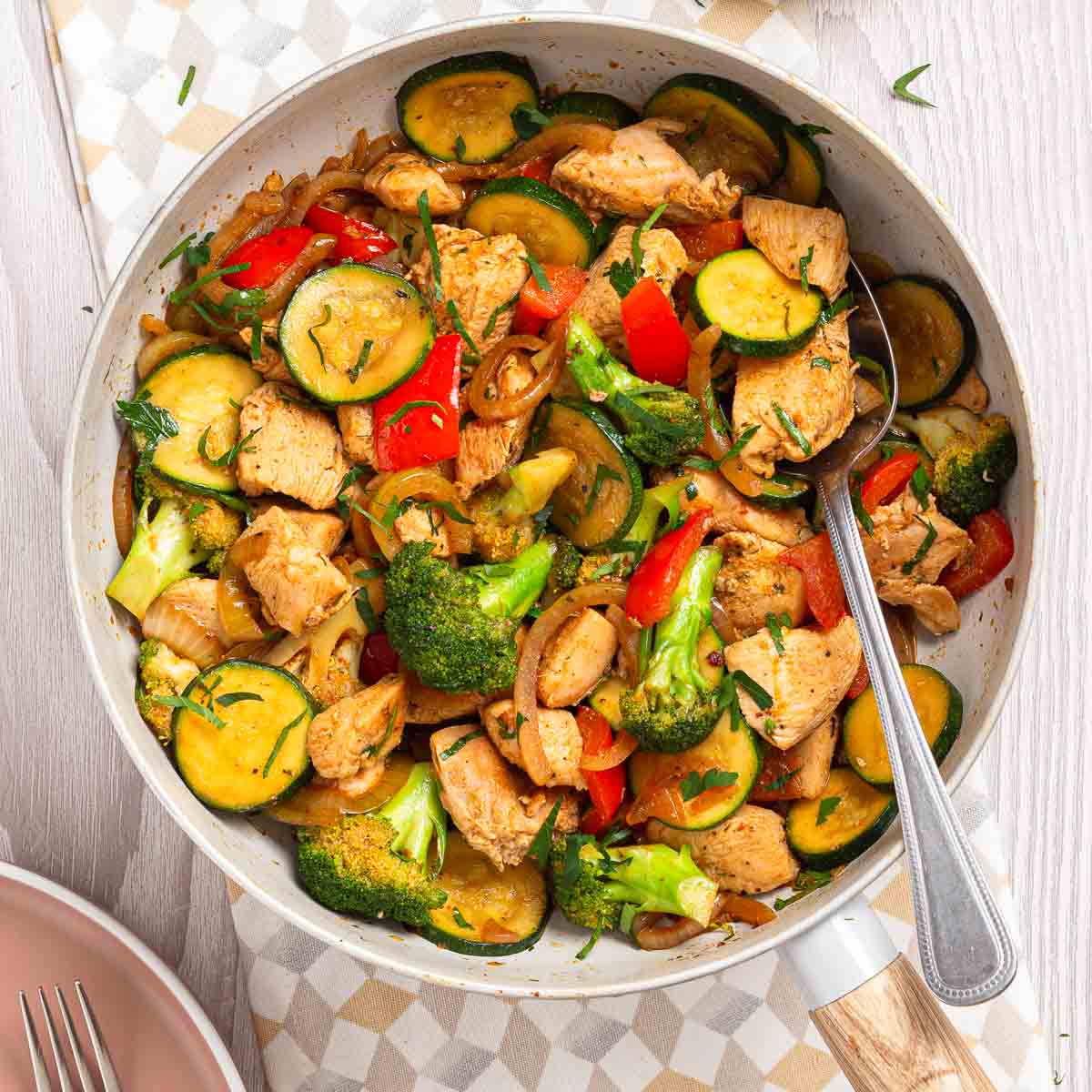 A keto chicken vegetable skillet with stir-fried chicken and  vegetables.