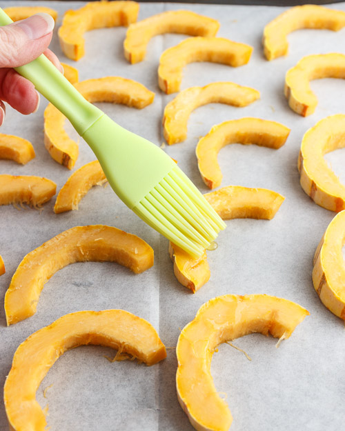 brushing the delicata squash with oil.