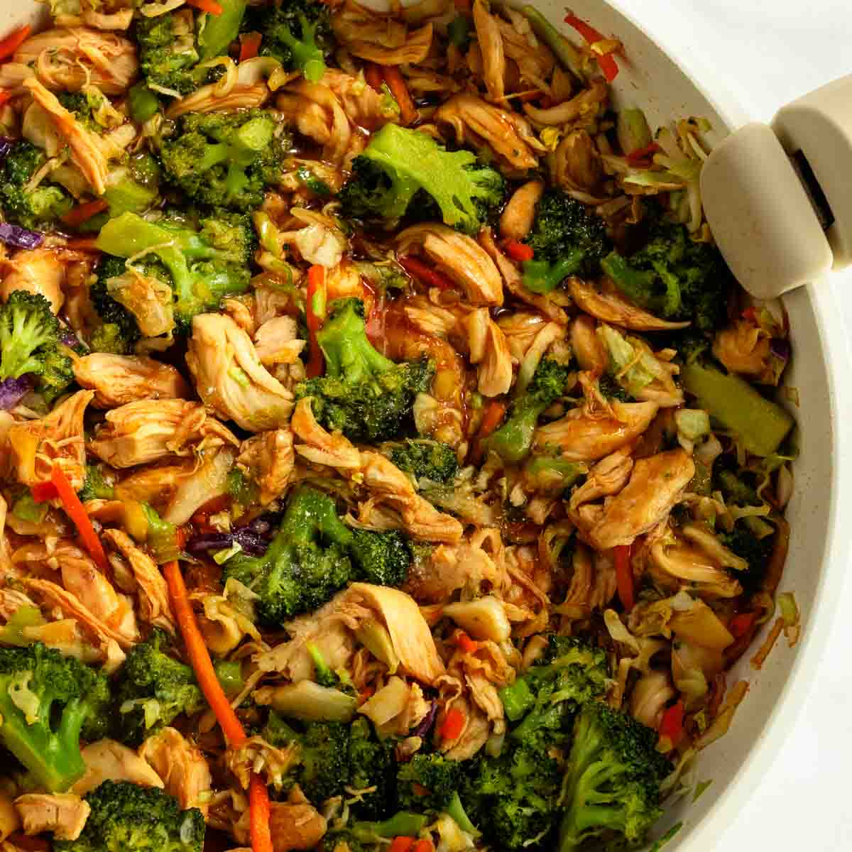 A pan of keto chicken teriyaki stir fry with vegetables and cabbage.