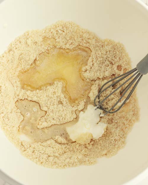 Add wet ingredients to dry for making the donut holes.