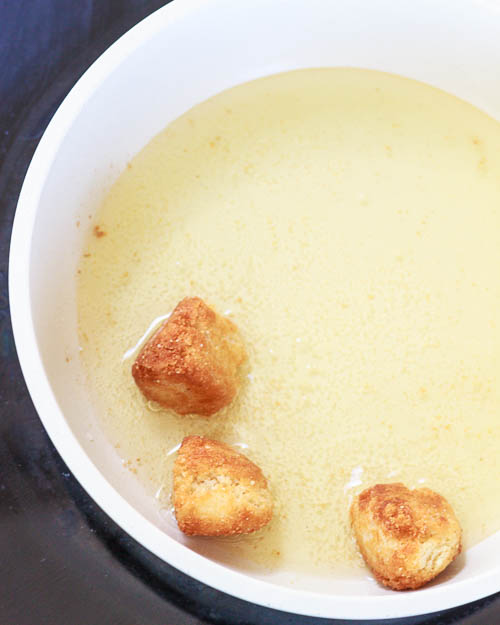 Frying the donut holes.