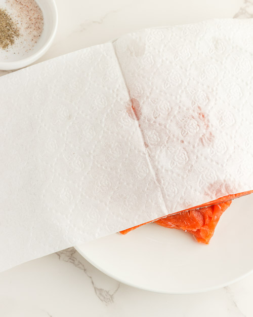 Rinsing and drying the salmon.