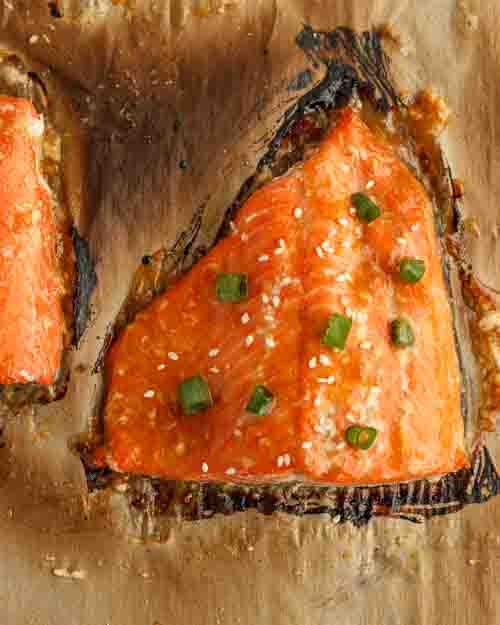 Garnishing the salmon.