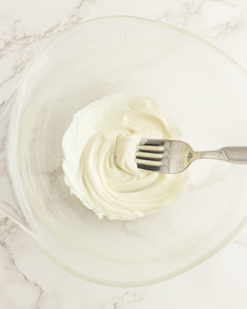 Melting the white chocolate frosting.