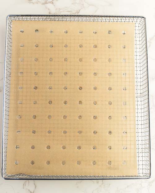 Preparing the air fryer basket.