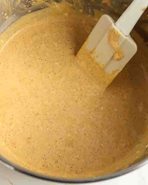 Mixing the cheesecake batter until smooth.