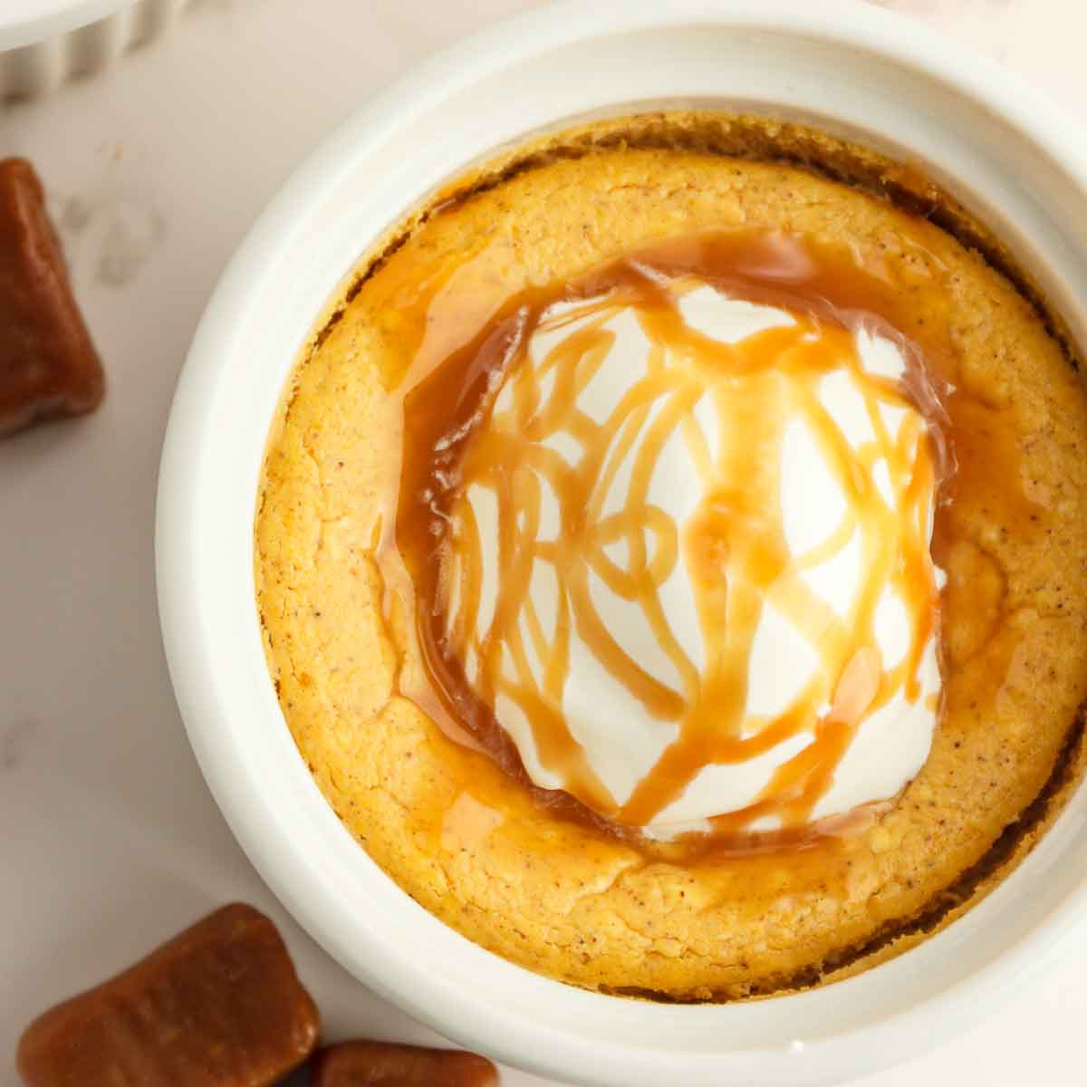 Garnishing and serving the keto pumpkin cheesecakes.