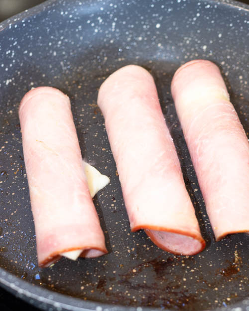 Frying the roll ups.