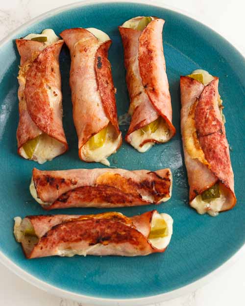 Remove and repeat frying remaining rolls.