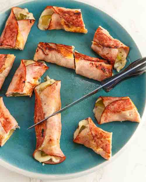 Slicing the rolls in half.