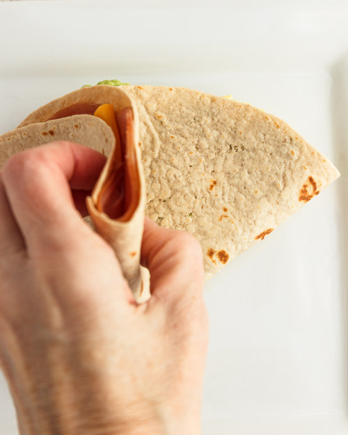 Folding the last section on the tortilla.