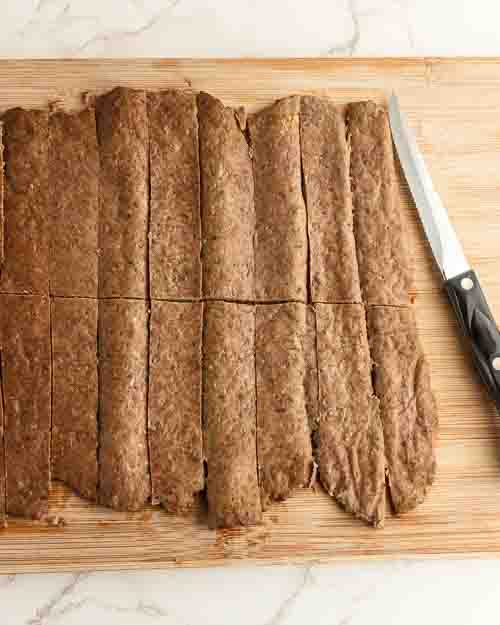 Slicing the gyro meat into strips.