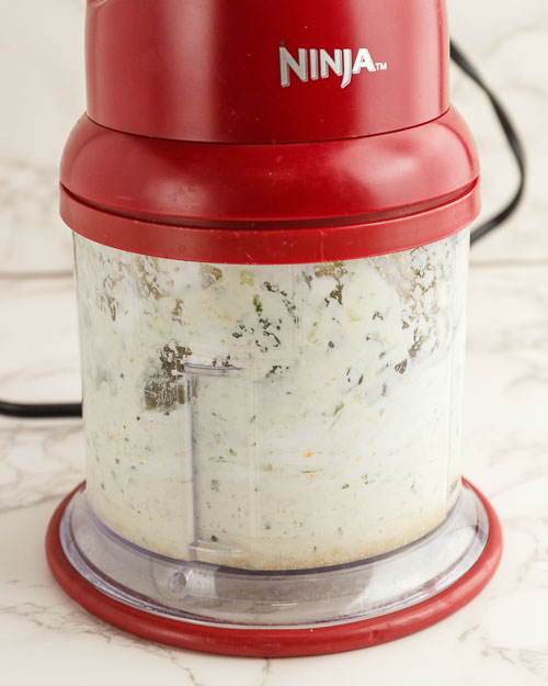 Blending the sauce in a food processor.