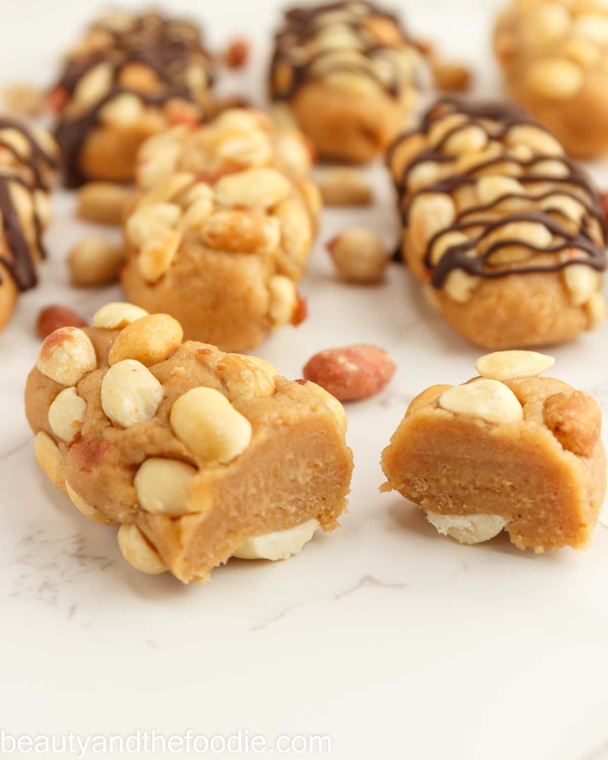 A keto payday bar with peanuts cut in half.