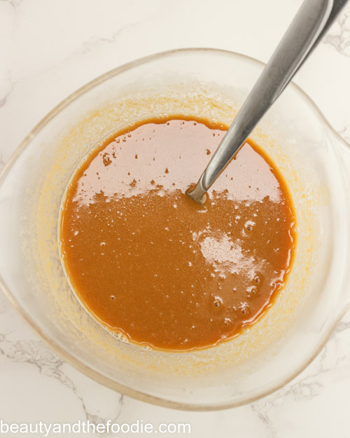 Mixing the caramel for making payday bars.